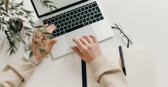 Job Success - Person in Beige Long Sleeve Shirt Using Macbook Pro