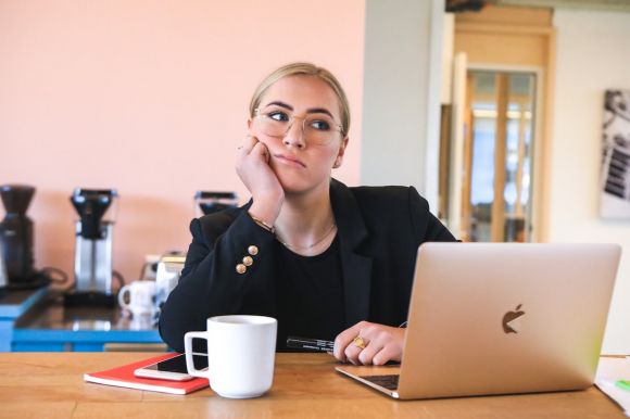 Job - woman in black long sleeve shirt using macbook