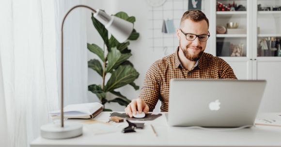 Job Market Success - Man Using Macbook